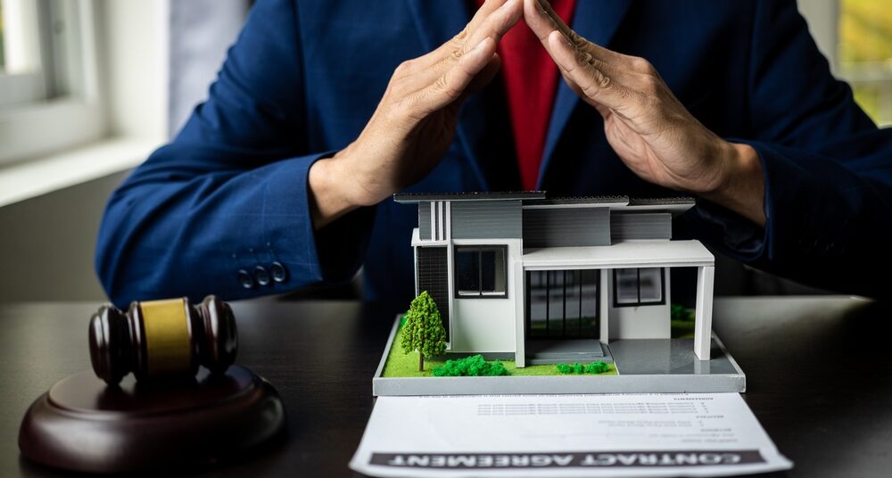 Consultation, contract agreement, lawyer focused on court hammer sitting on chair with client's indictment to settle home and land in court house auction concept: nonprofits sue los angeles