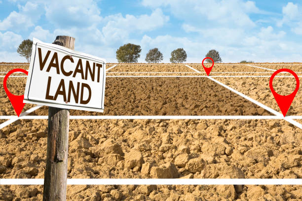 Plowed field with signboard and Vacant Land text - Land plot management - Real estate concept with a vacant land available for residential buildings construction, 2025 Density Bonus