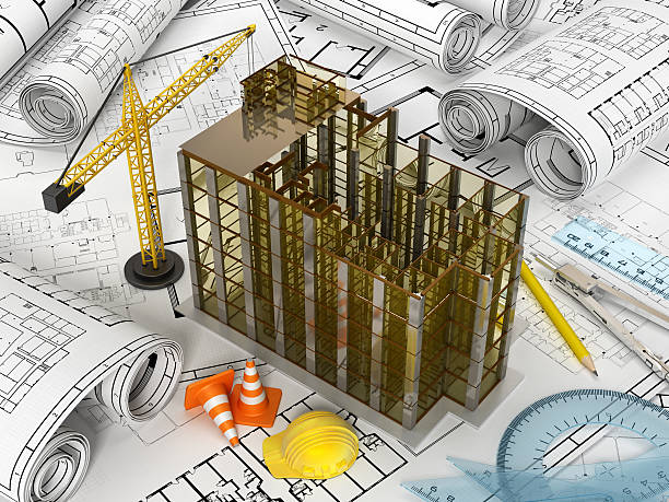 Building model and construction crane standing on plans with ruler sets.Similar images: