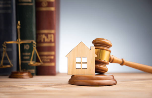 Judge auction and real estate concept. House model, gavel and law books