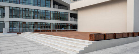 Podium Deck Construction - Modern buildings next to the empty slate Road
