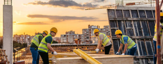 Land-Use and Pre-Construction Terms Every Developer Should Know - Construction workers working on a construction site (building exterior).Construction workers working on a construction site
