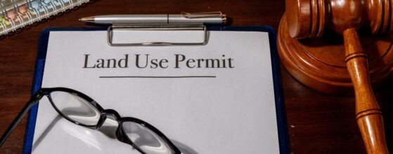 Property Law Concept Depicted with Land Use Permit Document, Gavel, and Pen Emphasizing Legal Approval for Land Development
