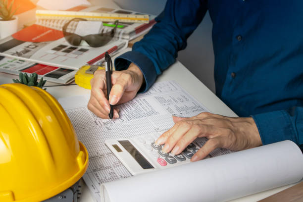 Engineers sit and work on building design and system work.,construction work safety, construction business and real estate