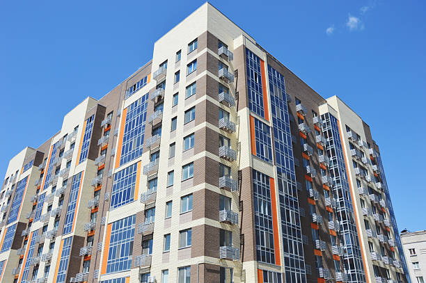 A high-rise residential apartment building with colorful decorative elements. Contemporary urban architecture.